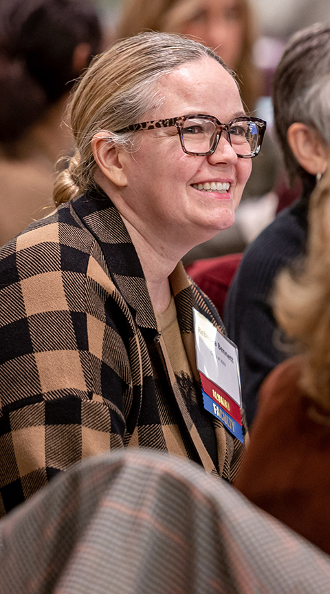 Smiling alumni at an event.