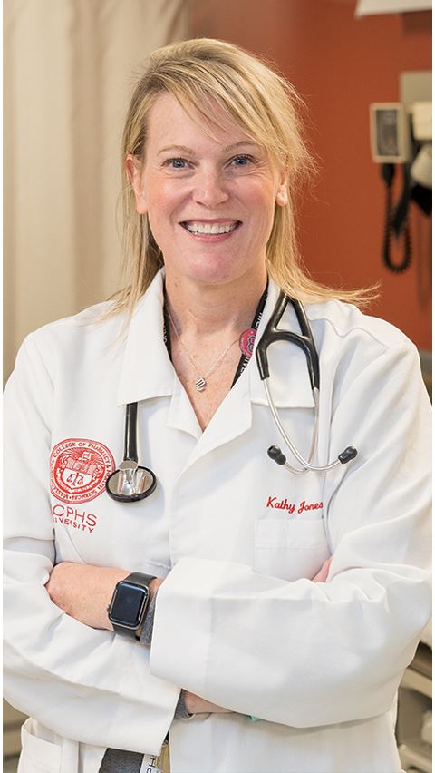 Faculty member wearing white coat and stethoscope.