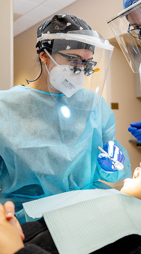 Female Dental Hygiene student in scrubs and mask. 
