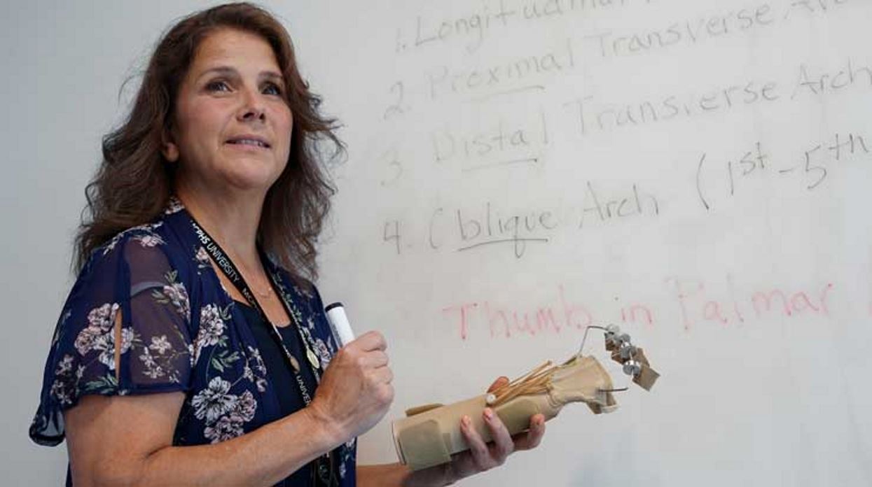 MCPHS Associate Professor Michelle Dowling, OTD, shows one of her many occupational therapy tools to students