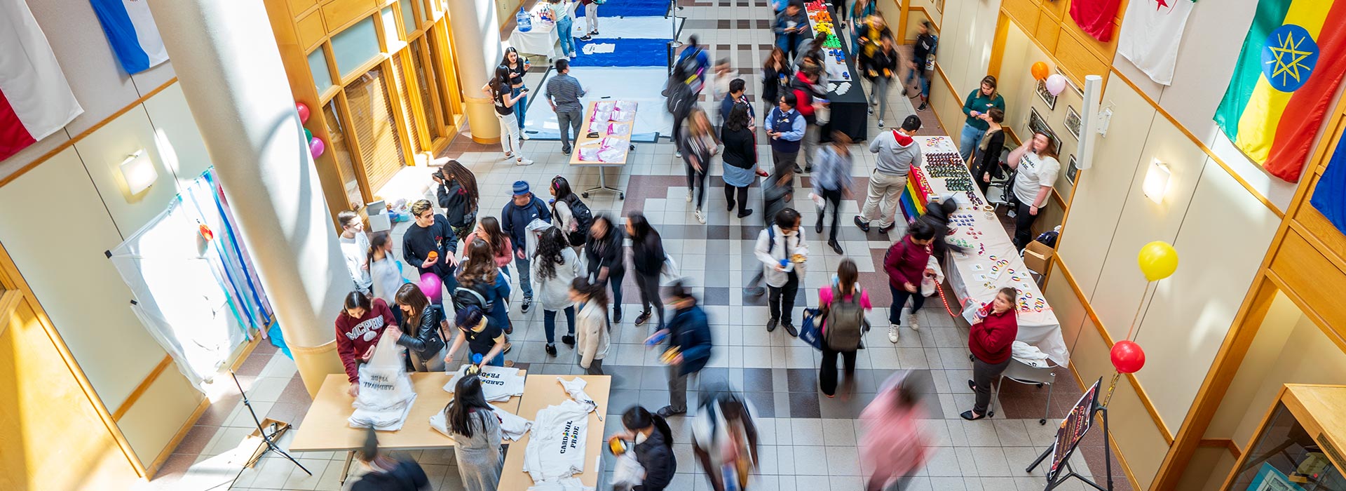 Students attending an event in the atrium on the MCPHS Boston campu.