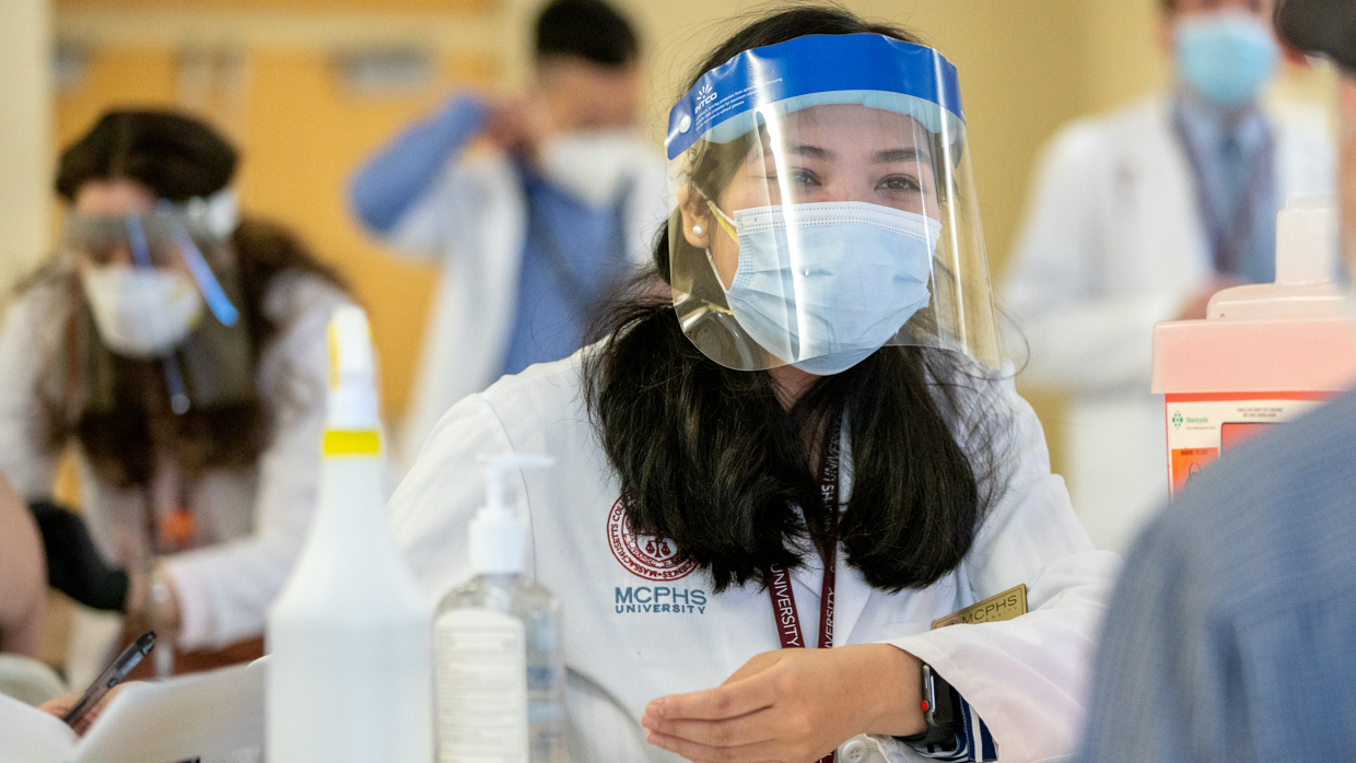 Female student in PPE gear. 