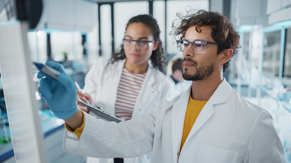 Male and female working in a lab. 