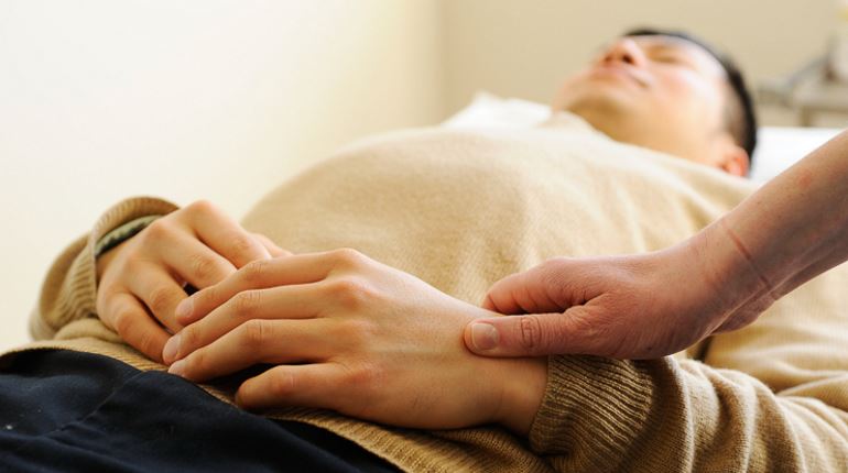 Man receiving acupuncture treatment